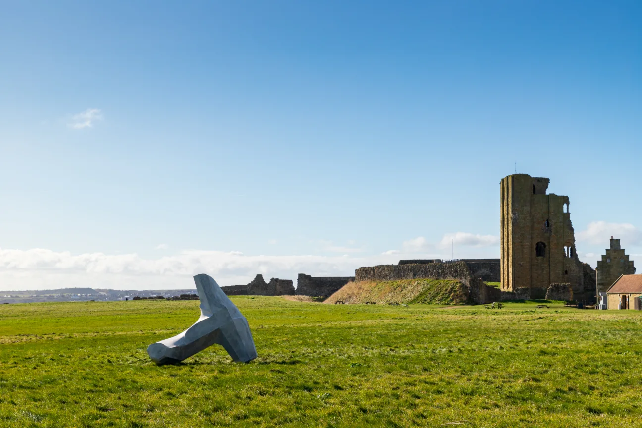 Ryan Gander’s concrete sculpture in the shape of a dolos, titled We are only human, stands on the grass area in front of Scarborough Castle