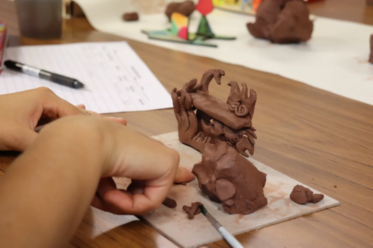 Juneau Projects creative workshops in progress with participants using clay and paint