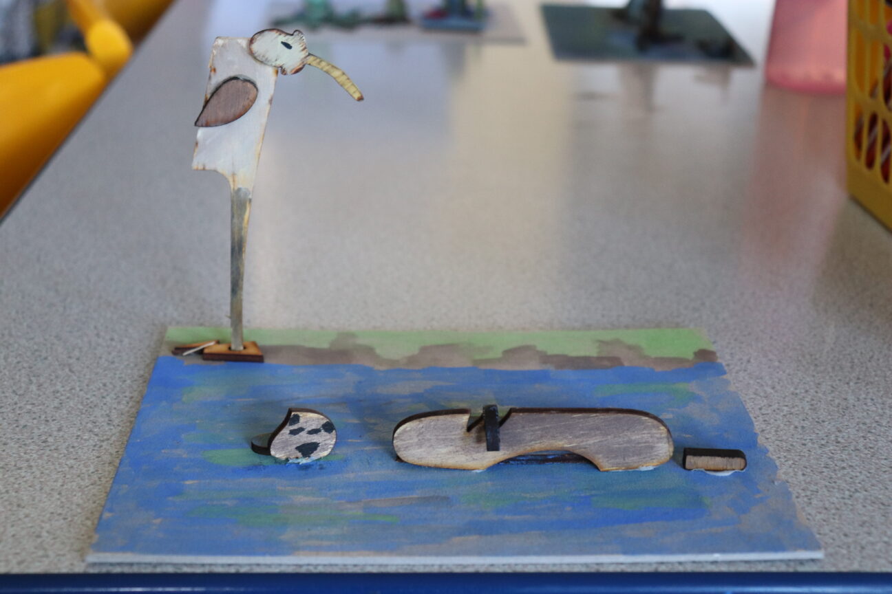 Juneau Projects creative workshops in progress with participants using wood and paint